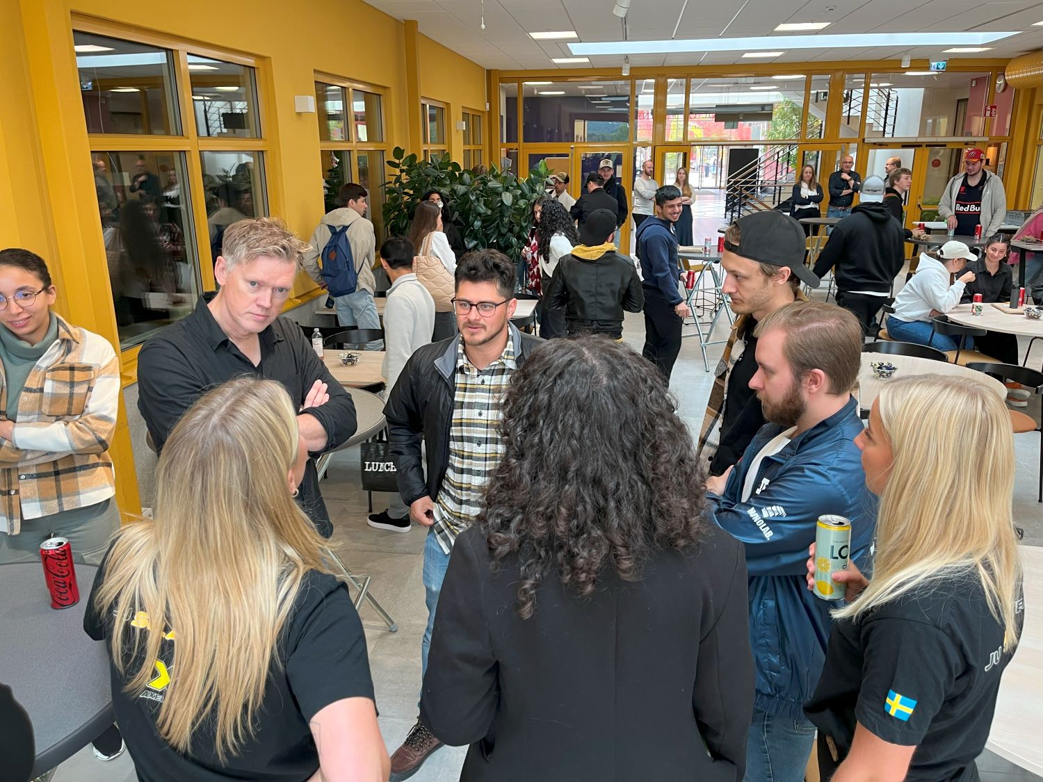 Students in conversation with some audience members.
