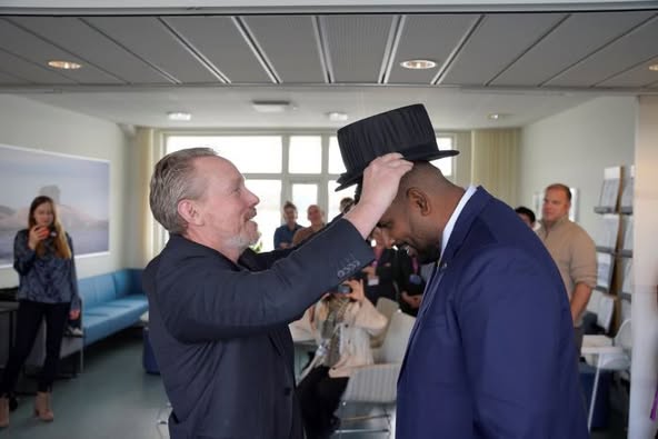 Prince Johnson receiving his doctoral hat