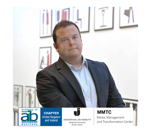 Man looking into camera and company logo